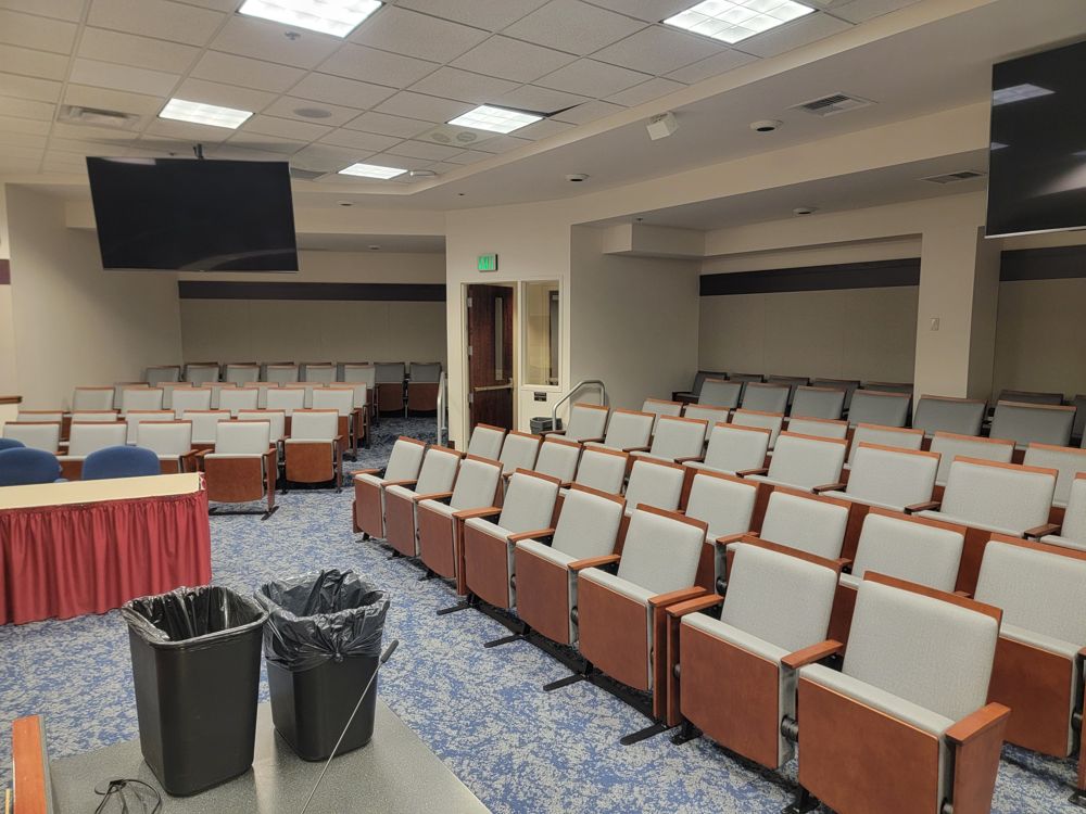 Multipurpose hall with wood-arm fixed seating